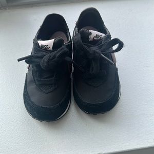 Baby Nike sneakers worn 4 times . In great condition
